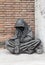 VATICAN - MAY 24, 2011: `Homeless Jesus ` , `Begging Christ ` statue in Rome. Jesus as begger sitting on the ground with his hand