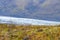 Vatnajoekull glacier in Iceland colorful vegetation in front of eternal ice and mountain slope