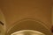 Vaulted ceiling with rough ocher plaster. Architecturally atypical ceiling in the hotel room. Dome shape of the ceiling