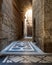 Vaulted passage leading to the Courtyard of Sultan Qalawun mosque with colorful marble floor, Cairo