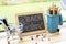 VBack to school background with slate blackboard, pencils on bin toy, calculator on shopping cart and pushpins on wooden