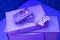 VCR for videotapes, a game joystick lie on a violet, purple vintage TV. Concept for the return of the lifestyle of youth and