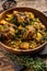 Veal beef oxtails tails stew with vegetables in a wooden plate. wooden background. Top view