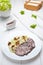 Veal beef with rice, cream sauce, vegetables and mushrooms