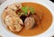 Veal fillet with rich sauce and dumplings