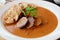 Veal fillet with rich sauce and dumplings