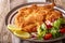 Veal milanese cotoletta alla milanese with lemon and fresh veg