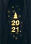 Vector 2021 Gold text. 3D Christmas Tree Ball on Papercut black waves with golden glitter halftone. Merry Christmas and