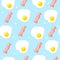 Vector background with bacon and scrambled eggs. Breakfast seamless pattern. Ornament for textile and wrapping