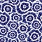 Vector blue indigo shibori circle flowers abstract pattern. Suitable for textile, gift wrap and wallpaper.