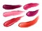 Vector collection of strokes of lipsticks of various colors on white.