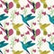 Vector colorful flying hummingbirds seamless pattern on light background with flowers