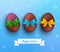 Vector easter chocolate egg with ribbon on blue