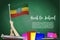 Vector flag of Ethiopia on Black chalkboard background. Education Background with Hands Holding Up of Ethiopia flag. Back to schoo
