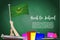Vector flag of Mauritania on Black chalkboard background. Education Background with Hands Holding Up of Mauritania flag. Back to