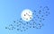 Vector flock of flying birds towards bright sun