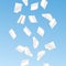 Vector flying shaded white papers on blue background.