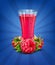 Vector glass of juice with raspberry on blue background