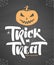 Vector Halloween poster with hand drawn type of Trick or Treat, pumpkin and spider on chalkboard background