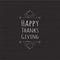 Vector Happy Thanksgiving text with leaves and pumpkin on dark wooden background.