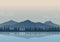 Vector illustration of beautiful foggy lake and mountain landscape