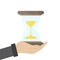 Vector illustration of businessman hand hold a hourglass. Business and time management concept. Successful start up