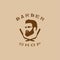 A vector illustration depicting a man`s face with a beard and glasses over two crossed razors. Logo of the men`s hairdresser.