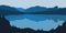 Vector illustration of forest panorama silhouette with lake