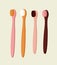 Vector illustration of four colored toothbrushes in pink, yellow, and burgundy color.