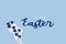 Vector illustration. Hand drawn elegant modern brush lettering of Happy Easter isolated on lite blue background.