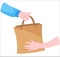 Vector illustration. Hands holding paper eco bag with grocery shopping. Hand-to-hand delivery