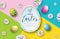 Vector Illustration of Happy Easter Holiday with Painted Egg and Flower on Abstract Background. International
