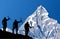 vector illustration of mount Machapuchare or Machhapuchhare and black silhouette of three climbers with ice axe in hand