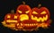 Vector illustration of orange glowing pumpkin lanterns for Halloween with carved faces placed on autumn leaves.