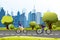 Vector illustration of people man and woman riding on a bicycle near city park. Modern city background. Cartoon vector