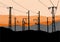 Vector illustration of Power lines, towers and pylons black silhouettes