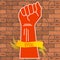 Vector illustration of a red hand clenched into a fist and a yellow ribbon with an inscription EPS10 on a brown brick wall back