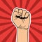 Vector illustration in retro style of clenched fist held high in protest