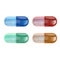 Vector illustration, set of four multicolored transparent gelatin capsules with medicines in the form of granules inside.