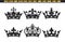 Vector Illustration Of Six Black Crowns Isolated Against A White Background.