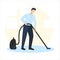 Vector illustration of a smiling man cleaning the room with vacuum cleaner. It represents a concept of cleanliness