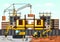 Vector illustration on the theme of a construction site. Construction of the building on background of the city