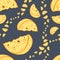 Vector image of yellow slices of cheese of different sizes on a dark gray background. Seamless pattern for textile