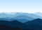 Vector landscape with blue misty silhouettes of mountains