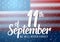 Vector Patriot Day Poster. Paper Lettering September 11th on Realistic American Flag Background with Confetti