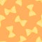 Vector pattern of farfalle pasta in flat style. Seamless pattern of hand-drawn yellow bow pasta randomly placed on an