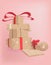 A vector pile of gift boxes in kraft paper on a pink background