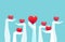 Vector of raised hands holding giving red color hearts isolated on light blue background