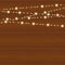 Vector realistic lantern garland on wood background with snowflakes