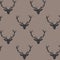 Vector repeat pattern with silhouettes of deer heads